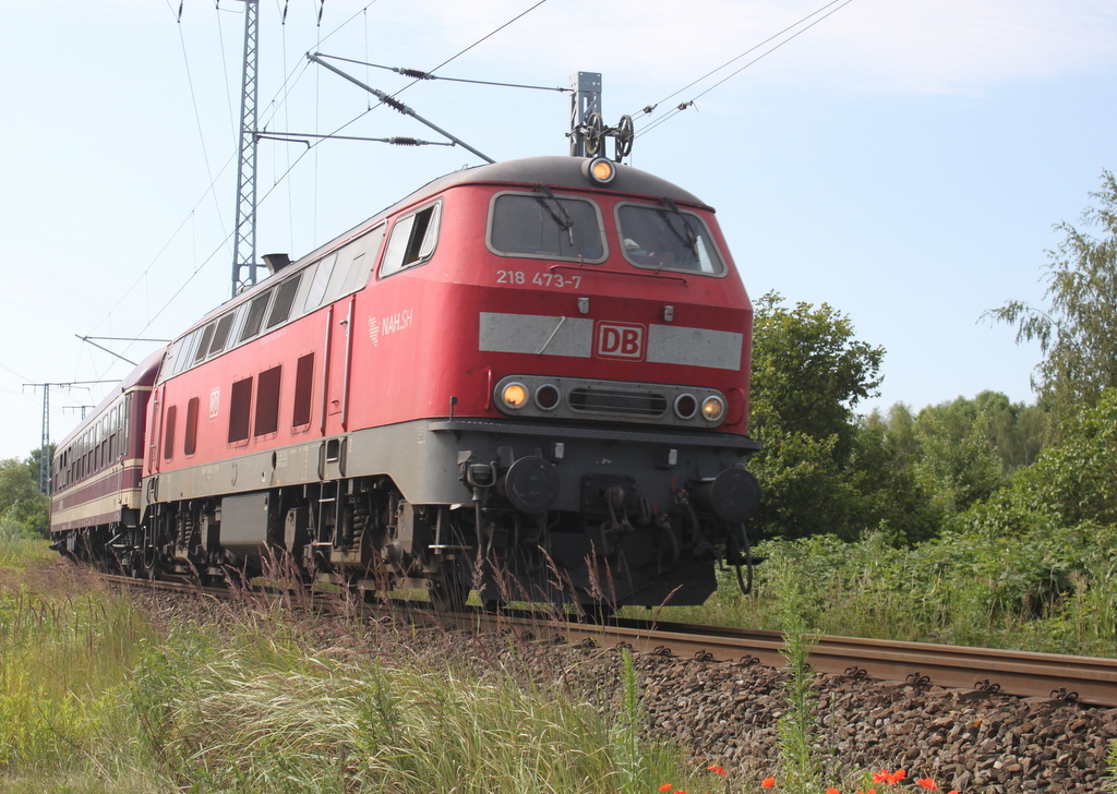 218 473-7 mit Sonderzug der HEL „Rügen-Express“ von Neumünster nach Binz Am Morgen des 13.07.2019 in der Güterumfahrung in Höhe Rostock Hbf.