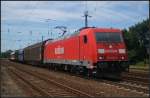 DB Schenker 185 209-4 mit einem St�ckgutzug in dem ein Regiowagen eingereiht war am 24.07.2012 in Nuthetal-Saarmund