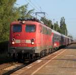 115 278-4 mit Sonderzug 2680 von Warnemnde nach Berlin-Lichtenberg bei der Durchfahrt um 07.30 Uhr im S-Bahnhof Rostock-Holbeinplatz.18.07.2013