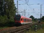 An der Westeinfahrt von Bergen/Rgen kam,am 19.Juli 2011,der RE 13015 aus Rostock nach Sassnitz.