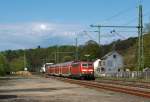 111 011-3 zieht den RE 9 (Rhein-Sieg-Express) Aachen - Kln - Siegen in Richtung Siegen vorbei,  hier am 30.04.2012 in Mudersbach.