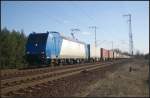 ITL 185 522-0 mit Container aus dem Gegenlicht (gesehen Berlin Wuhlheide 22.03.2012)