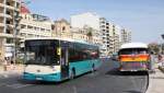 Ein KingLong Stadtbus passiert einen alten AEC Reliance Stadtbus, der am 15.5.2014 aber als solcher schon ausgedient hatte und als Verkaufswagen am Fhrhafen in Sliema in Malta genutzt wurde.