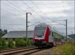 Obwohl der Linksverkehr in Luxembourg noch nicht eingef�hrt wurde, �berraschte mich der IR 3714 Luxembourg - Troisvierges, als er mir in Erpeldange/Ettelbr�ck auf dem  falschen  Gleis vor die Kamera