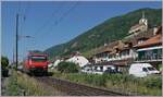 F�r einen gr�sseren Sportanlass fuhren einige Extraz�ge f�r teilnehmende Sportgruppen via Juras�dfuss nach Lausanne. Das Bild zeigt einen solchen Extrazug auf der Leerr�ckfahrt bei Ligerz. Seit am Juras�dfuss die ICN RABe verkehren, sind Z�ge mit Re 460 hier eher selten zu sehen. 

19. Juni 2025
