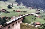 BLS Ae 8/8 und im ersten Drittel eingestellt Ae 6/8 mit Zementzug auf dem Kanderviadukt am 28.07.1980.