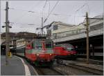 Die  Swiss-Express  Re 4/4 II 11108 mit einem IR nach Brig beim Halt in Lausanne.