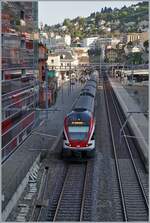 Die beidne SBB RABe 511 114 und 115 haben als RE33 nach Annemasse den Bahnhof von Montreux erreicht.